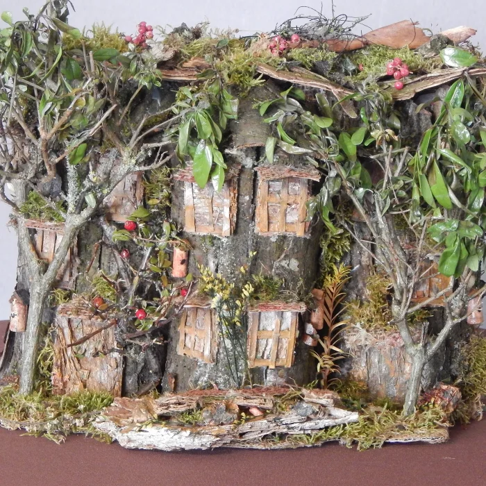 grosses-haus-mit-bäaeumen-vor-fenster